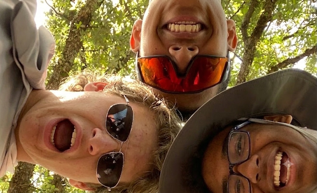 Three smiling Troop 803 scouts leaning in for a close-up selfie under the trees
